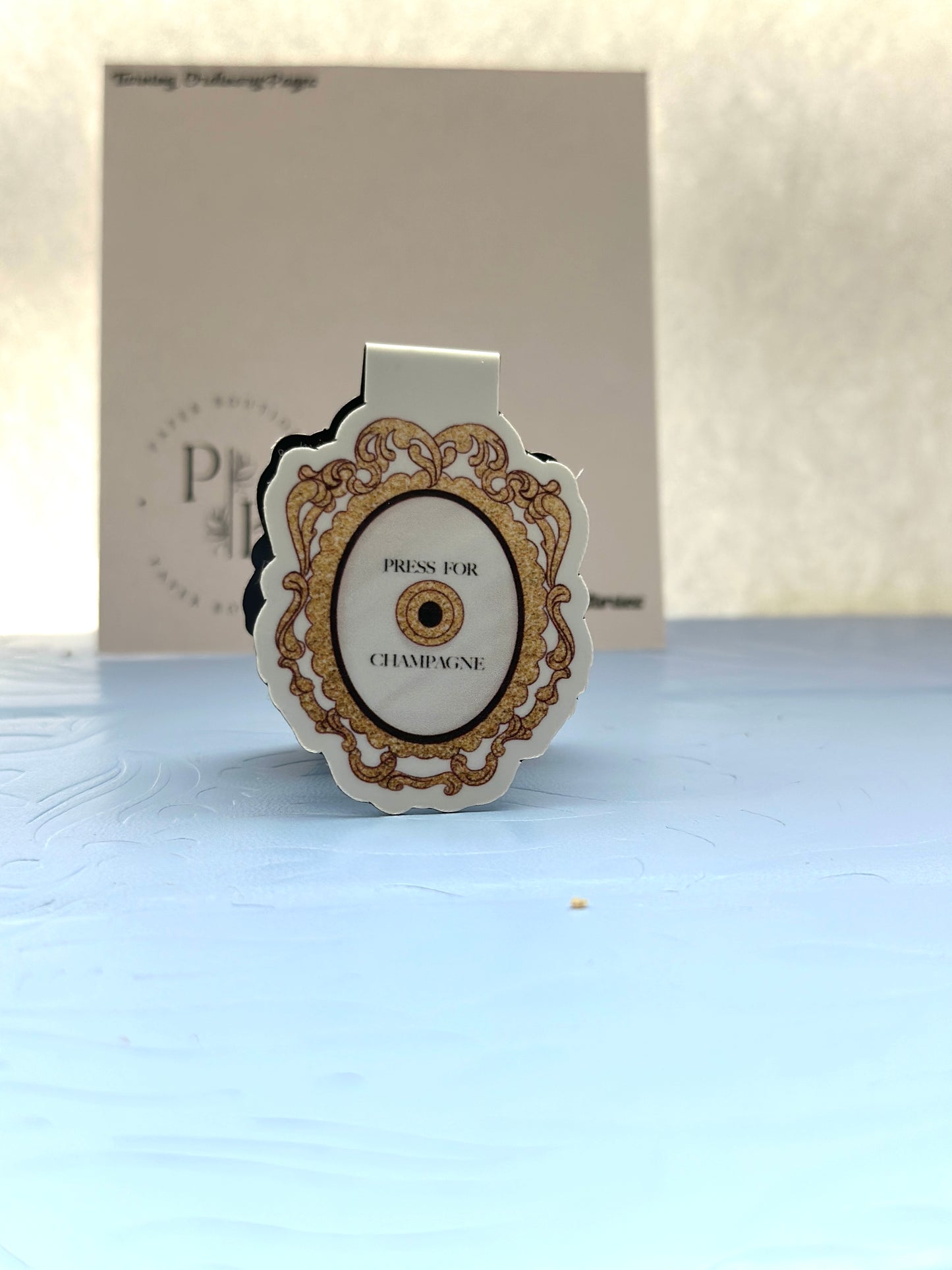 PRESS FOR CHAMPAGNE MAGNETIC BOOKMARK